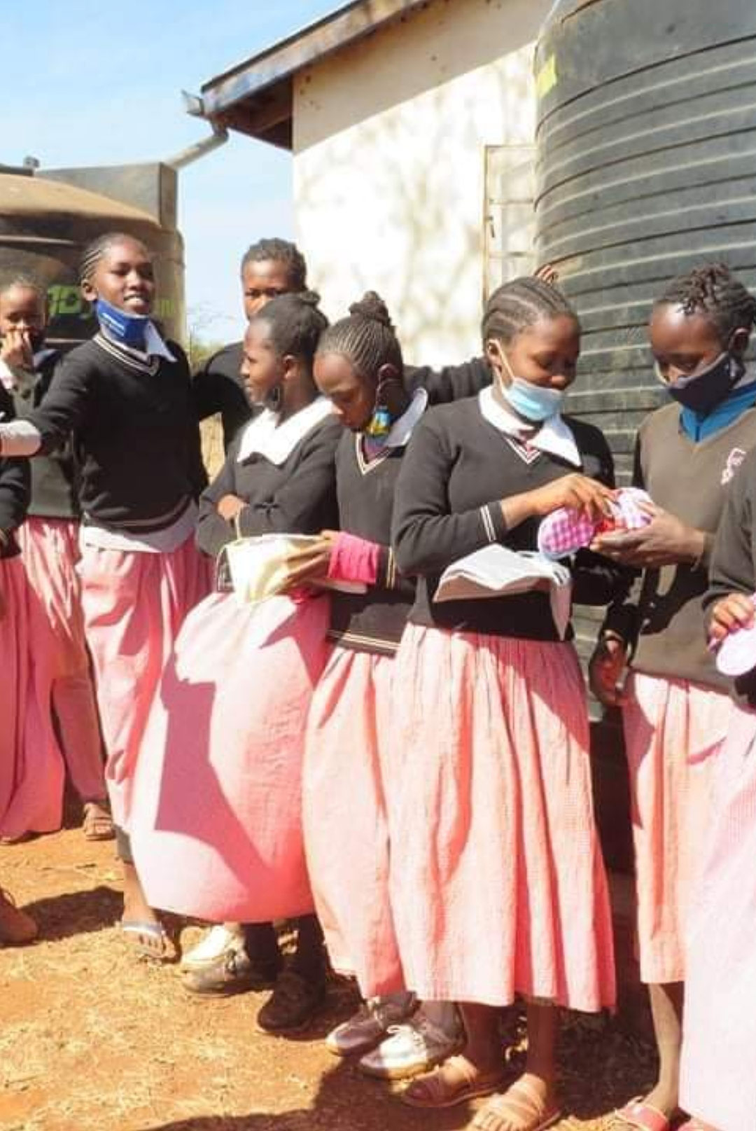 Schoolgirls learn about sanitary pads